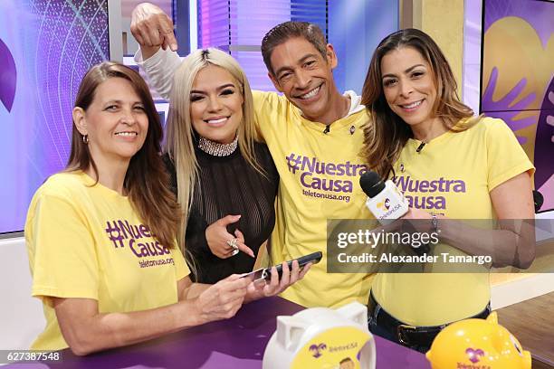 Musician Karol G, Johnny Lozada, Lourdes Stephen are seen during Univision's Teleton 2016 at Univision Studios on December 3, 2016 in Miami, Florida.