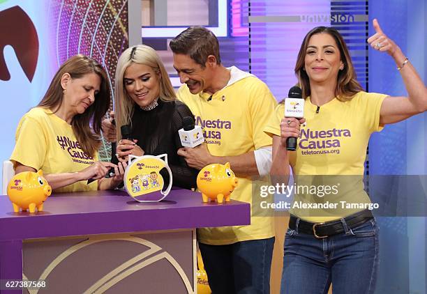 Musician Karol G, Johnny Lozada, Lourdes Stephen are seen during Univision's Teleton 2016 at Univision Studios on December 3, 2016 in Miami, Florida.