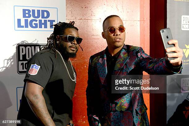 Singers T-Pain and Anderson .paak pose backstage during Power 106 Cali Christmas at The Forum on December 2, 2016 in Inglewood, California.