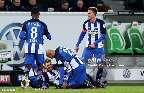 Alexander Esswein of Berlin celebrates after scoring his team's second goal with Salomon Kalou , John Anthony Brooks and Sebastian Langkamp of Berlin...