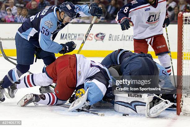 Milwaukee Admirals G Marek Mazanec looses his helmet as Milwaukee Admirals D Alexandre Carrier , defends against Cleveland Monsters C Paul Bittner...