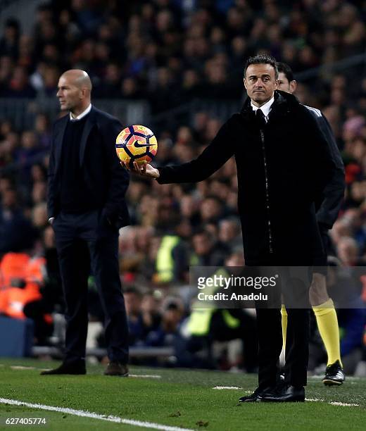 Head coach of Real Madrid Zinedine Zidane and Head coach of Barcelona Luis Enrique are seen during the La Liga football match between FC Barcelona...