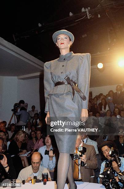 French designer Pierre Cardin shows his 1979-1980 fall-winter women's haute couture collection in Paris. The model is wearing a structured grey...