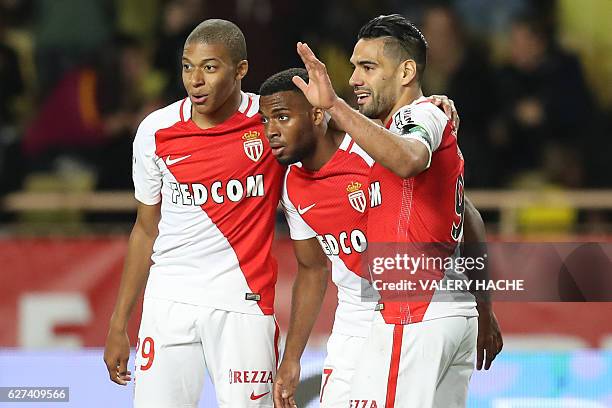 Monaco's Colombian forward Radamel Falcao celebrates with Monaco's French forward Kylian Mbappe and Monaco's French midfielder Thomas Lemar after...