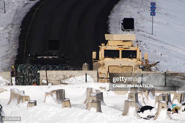 Police guard a bridge near Oceti Sakowin Camp on the edge of the Standing Rock Sioux Reservation on December 3, 2016 outside Cannon Ball, North...