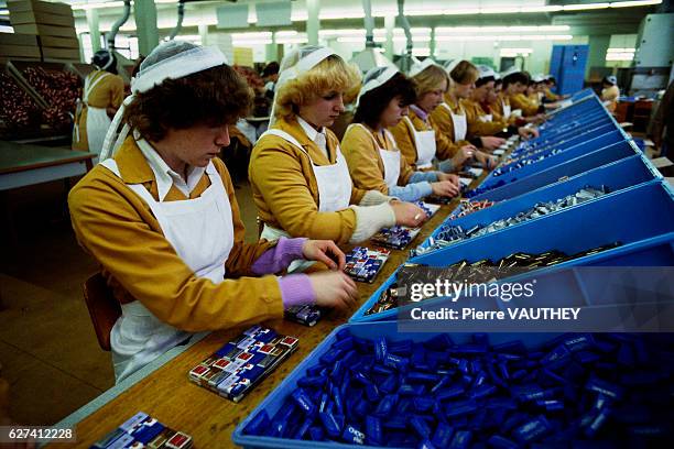 Factory workers make and sort candy at the Nestle chocolate factory in Broc, Switzerland.