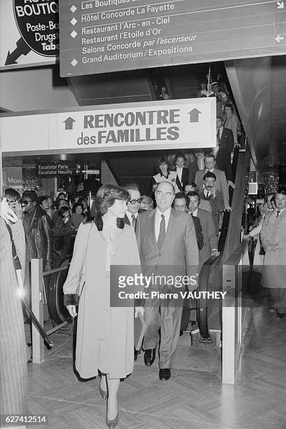 French President Francois Mitterrand and First Lady Danielle Mitterrand step of an escalator as the President prepares to address the National Union...