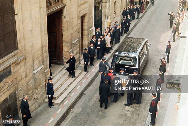 Eight pallbearers carry the coffin of French President Georges Pompidou into a church during his state funeral. Pompidou served as Prime Minister of...