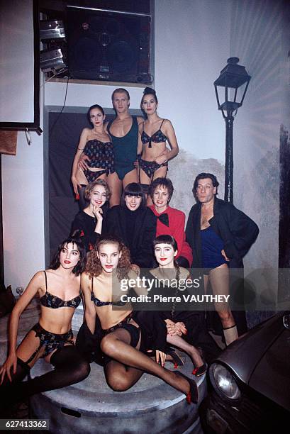 French designer Chantal Thomass is surrounded by models wearing her latest lingerie collection. Joining her is French actor Jean-Claude Dreyfus .