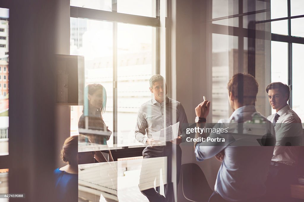 Business people having discussion in board room