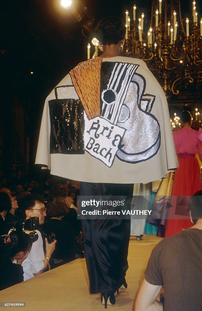A fashion model wears a Picasso-inspired haute couture cape over a ...