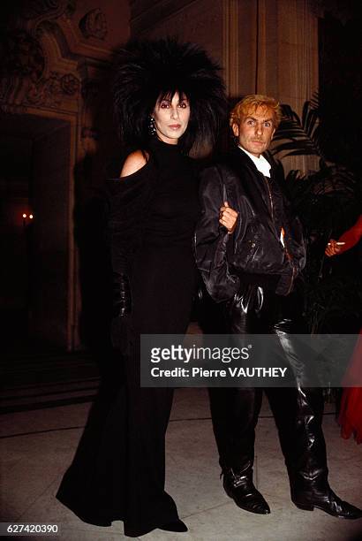 American singer Cher and French designer Claude Montana attend the 1985 Council of Fashion Designers of America Awards in New York.