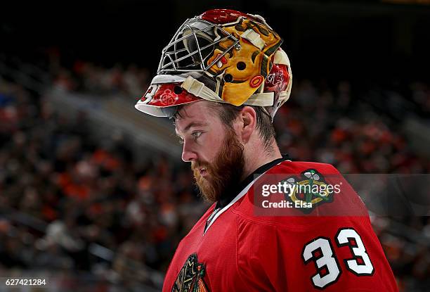 Scott Darling of the Chicago Blackhawks looks on in the second period against the Philadelphia Flyers on December 3, 2016 at Wells Fargo Center in...