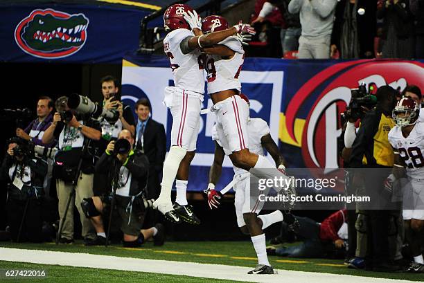 Minkah Fitzpatrick of the Alabama Crimson Tide celebrates with Marlon Humphrey after returning an interception for a touchdown against the Florida...