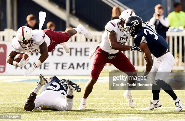 Safety Jay Bowdry of the Georgia Southern Eagles upends wide receiver Tevaris McCormick of the Troy Trojans on December 3, 2016 at Paulson Stadium in...