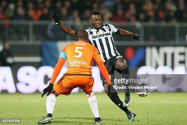 Nicolas Pepe of Angers and Zarko Toure of Lorient during the Ligue 1 match between Angers SCO and FC Lorient on December 3, 2016 in Angers, France.