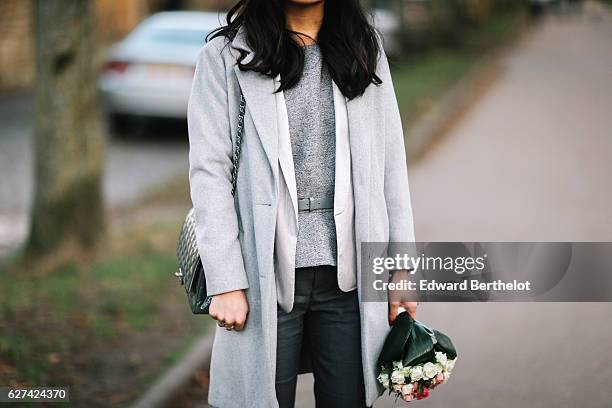 May Berthelot, fashion and life style blogger, is wearing a wedding themed outfit consisting of a New Look gray long coat, a Sandro jacket, a...