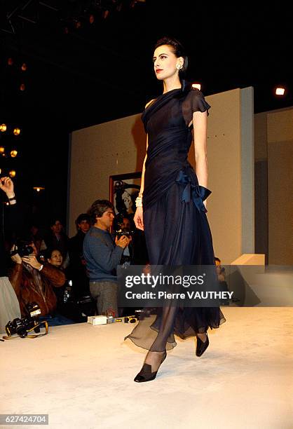 French fashion model Ines de la Fressange models the latest haute couture women's line by French fashion house Chanel at the 1987 Spring-Summer...