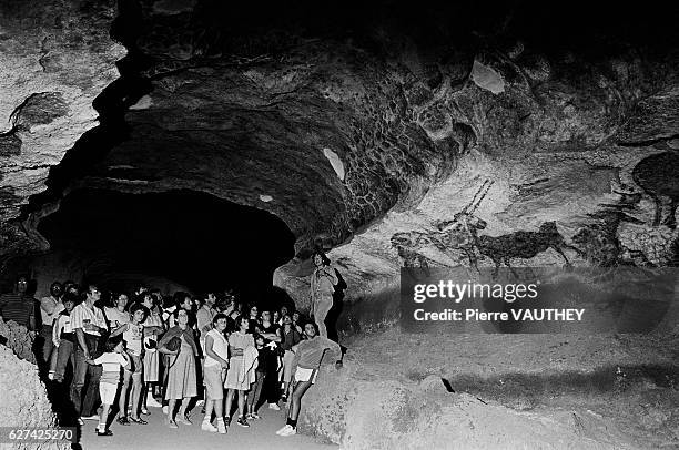 Visitors Inside Lascaux II Grotto in France