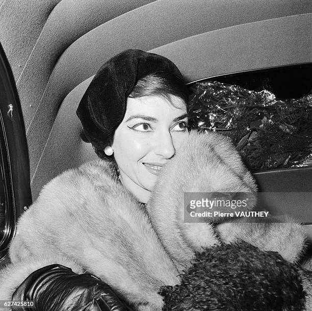 Opera singer Maria Callas visits Paris. She is accompanied by her husband, Italian industrialist Giovanni Battista Meneghini .