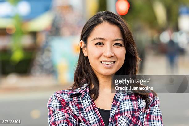 smiling asian woman looking at the camera - philippines women stock pictures, royalty-free photos & images