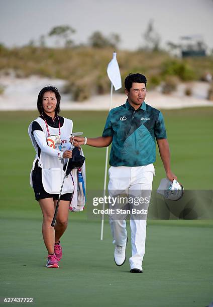 Hideki Matsuyama of Japan exits from the 18th hole during the third round of the Hero World Challenge at Albany course on December 3, 2016 in Nassau,...