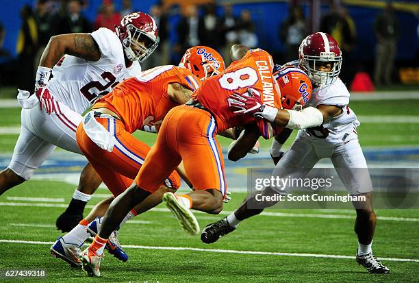 Anthony Averett of the Alabama Crimson Tide tackled Antonio Callaway of the Florida Gators in the first half during the SEC Championship game at the...