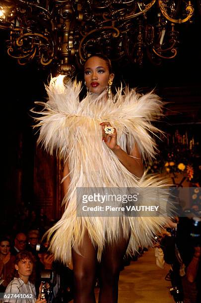 Fashion model Naomi Campbell wears a furry cocktail dress by French fashion designer Yves Saint Laurent at his autumn-winter 1987-1988 fashion show...