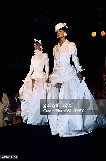 Designer Karl Lagerfeld displays his women's haute couture line for Chanel at the 1990-1991 Autumn-Winter fashion show in Paris. Models Linda...