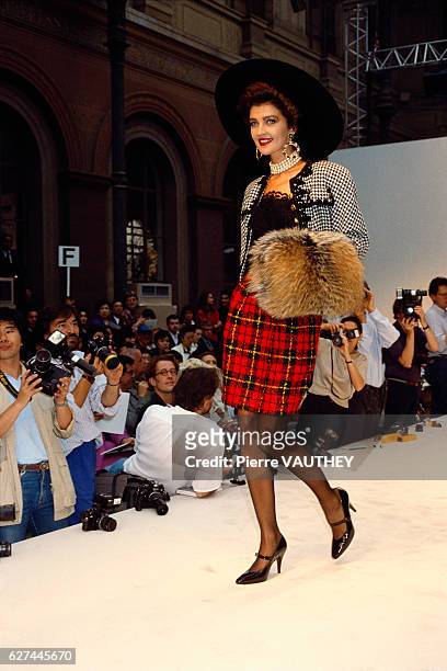 Fashion model wears the latest in haute couture women's fashions by French design house Chanel at the 1987-1988 Fall-Winter fashion show in Paris....