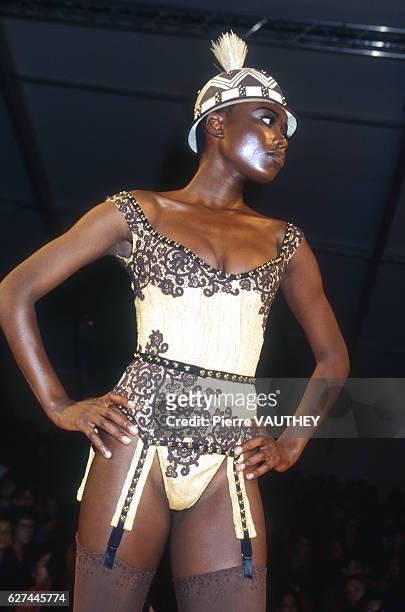 Fashion model wears a women's ready-to-wear lace leotard by French fashion designer Chantal Thomass at her Spring-Summer 1992 fashion show in Paris.