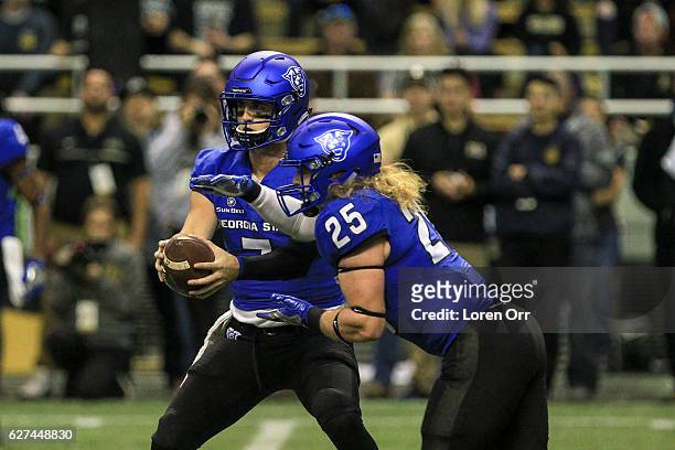 Quarterback Conner Manning hands the ball off to running back Kyler Neal of the Georgia State Panthers during first half action on December 3, 2016...