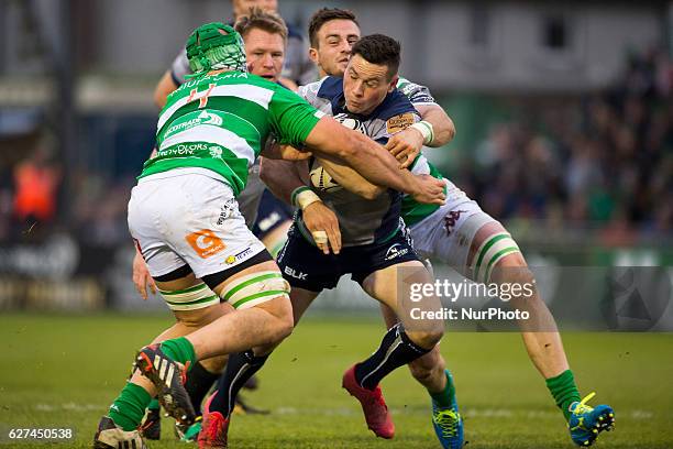 John Cooney of Connacht tackled by Abraham Steyn and Marco Lazzaroni of Benetton during the Guinness PRO12 Round 10 match between Connacht Rugby and...