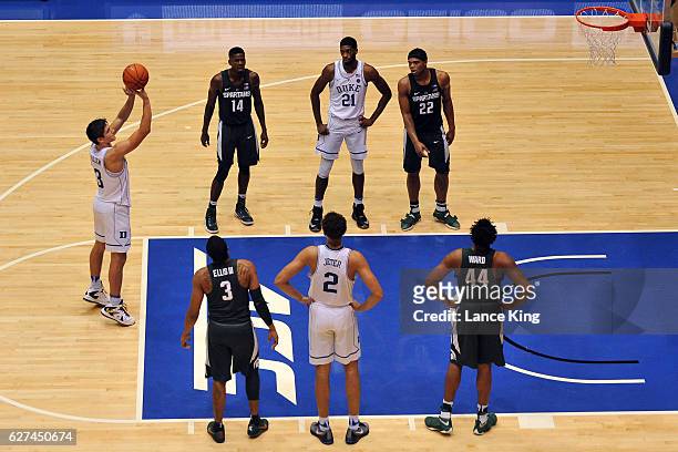 Grayson Allen of the Duke Blue Devils shoots a free throw during their game against the Michigan State Spartans at Cameron Indoor Stadium on November...