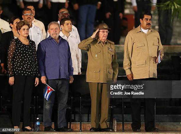 Cuban President Raul Castro salutes during the Cuban National Anthem as he stands with Brazilian impeached former president Dilma Rousseff , former...