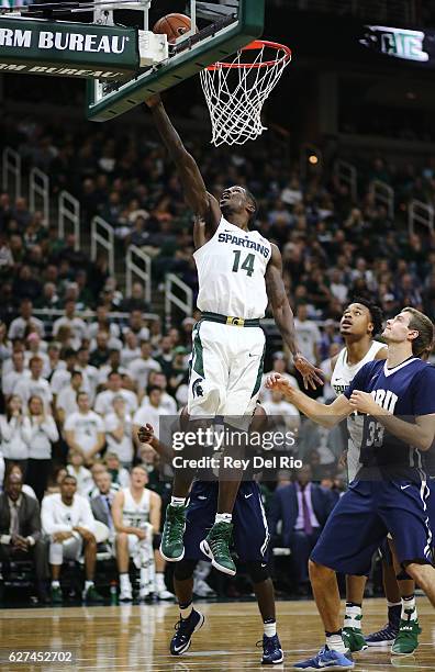 Eron Harris of the Michigan State Spartans shoots against the Oral Roberts Golden Eagles in the second half at the Breslin Center on December 3, 2016...