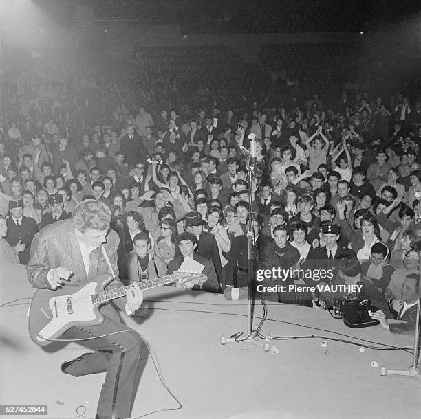 Young French singer Johnny Hallyday performs for the first time on stage at the Alhambra in Paris. The popular singer and guitarist was France's...