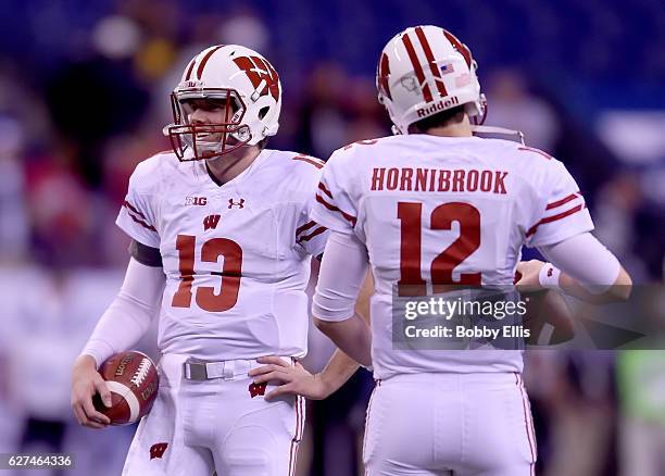 Bart Houston of the Wisconsin Badgers and Alex Hornibrook of the Wisconsin Badgers warm up before the Big Ten Championship game against the Penn...
