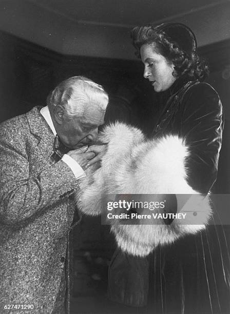 French Director Sacha Guitry Kissing Lana Marconi's Hand