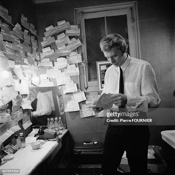 French singer and actor Johnny Hallyday in his dressing room at the Olympia music hall.