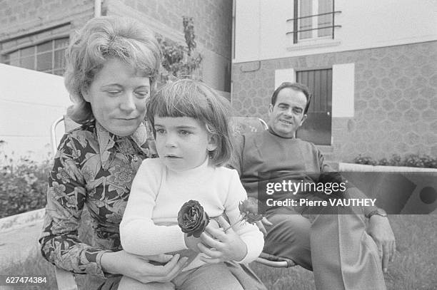 Georges Marchais, Secretary General of the French Communist Party, sits in the backyard with his wife, Liliane, and daughter at his family's home in...