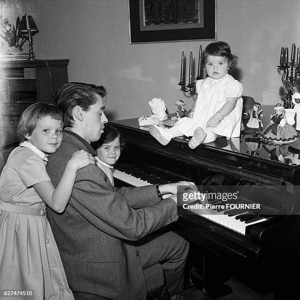 Belgian singer, songwriter, actor and director Jacques Brel with his three daughters Chantal France and Isabelle, 1.