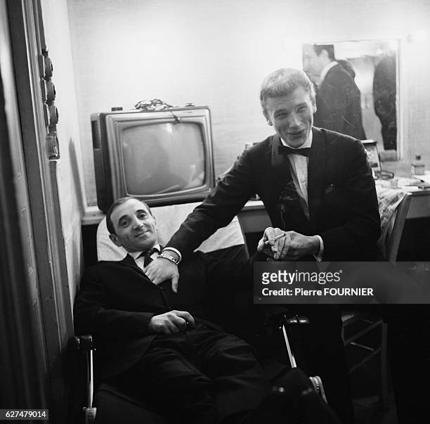 Charles Aznavour in his dressing room with Johnny Hallyday at the Olympia music hall.