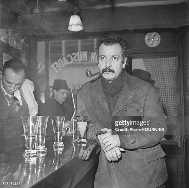 Postwar French singer-songwriter Georges Brassens is famed for his songs Le Gorille and Les Copains 'D'Abord. Brassens smoking a pipe in a cafe.