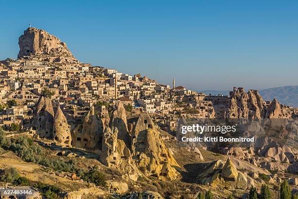 uchisar castle and village from pigeon valley, turkey - göreme stock-fotos und bilder