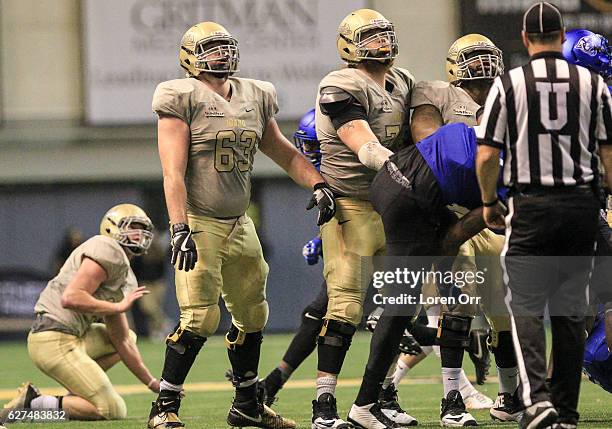 Offensive lineman Calvin White of the Idaho Vandals and his teammates watch a successful field goal during second half action against the Georgia...