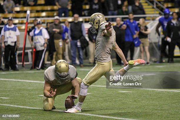 Kicker/punter Austin Rehkow of the Idaho Vandals kicks a field goal during second half action against the Georgia State Panthers on December 3, 2016...
