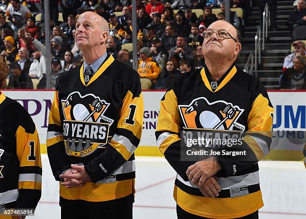 Craig Patrick and Scotty Bowman stand during a pre-game ceremony honoring the 1991-1992 back to back Stanley Cup Champions during at PPG Paints Arena...