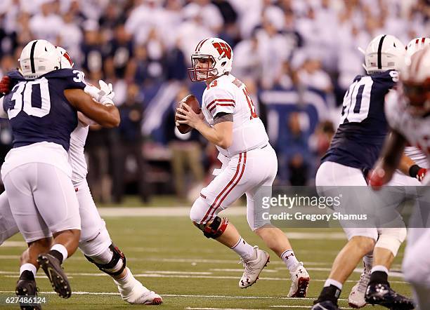 Bart Houston of the Wisconsin Badgers drops back to pass during the first quarter of the Big Ten Championship game against the Penn State Nittany...