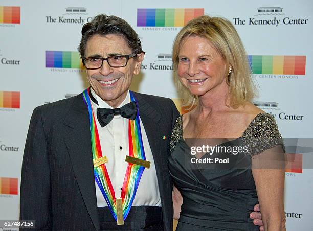 Kennedy Center Honoree Edward Vallella and his wife, Linda, a former Olympic figure skater, arrive for the formal Artist's Dinner honoring the...